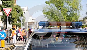 Police car with sirens during a demonstration in the city