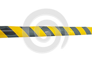 a police caution line area, do not cross, security warning black and yellow tabe