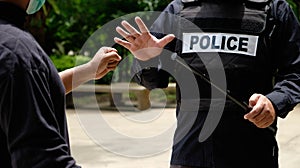 Police control violence in protest, arrest and suppress violence Handcuffing the accused Promoter