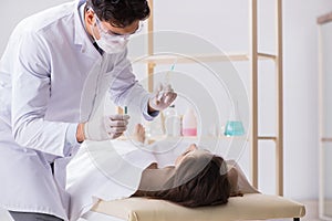 The police coroner examining dead body corpse in morgue