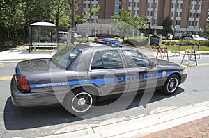 Police cruiser parked on side of road