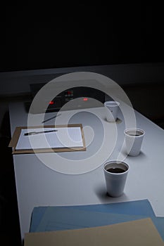 Police Custody Interview Room with Coffee Cups