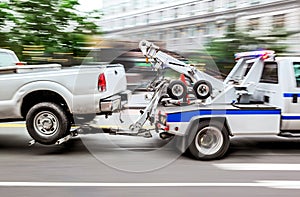 Tow truck delivers the damaged vehicle