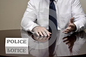 Police At Desk with Name Sign