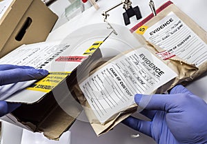 Police expert saved in a box records and evidence of a case of murder in the laboratory scientist