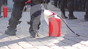 Police with fire extinguisher to disperse rallies