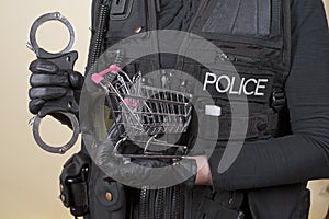Police handcuffs and a supermarket trolley