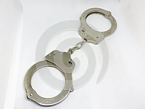 Police handcuffs and white background