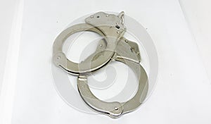 Police handcuffs and white background