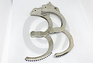 Police handcuffs and white background