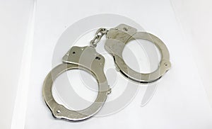 Police handcuffs and white background