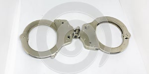 Police handcuffs and white background