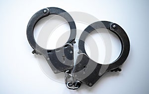 Police handcuffs on a white background. Arrest.