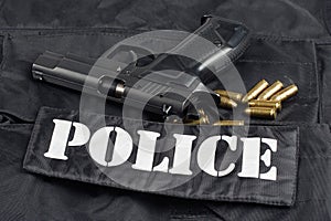 police handgun on black uniform