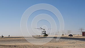 Police helicopter in the desert. Police training and rescue operation concept.