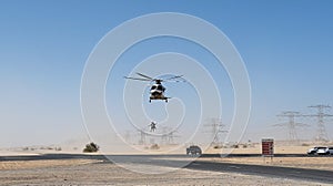 Police helicopter in the desert. Police training and rescue operation concept.