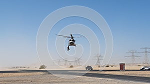 Police helicopter in the desert. Police training and rescue operation concept.