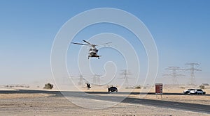 Police helicopter in the desert. Police training and rescue operation concept.