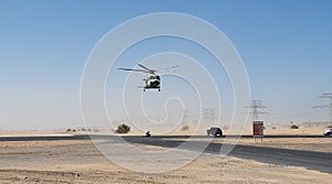 Police helicopter in the desert. Police training and rescue operation concept.