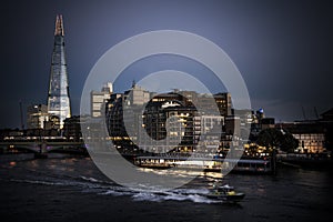 Police launch speeding on Thames at nightfall