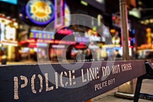 Police line crime scene in New York City with blurry background