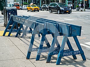 Police line do not cross NYPD wooden barrier