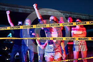 Police line and smoke. Group of protesting young people that standing together. Activist for human rights or against government