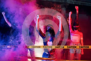 Police line and smoke. Group of protesting young people that standing together. Activist for human rights or against government