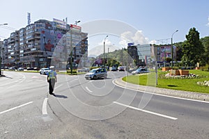 Policeman restricting the traffic on a street