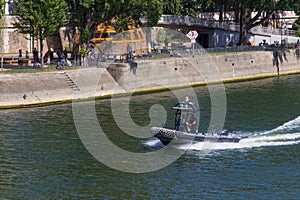 PARIS, FRANCE - JUNE 23, 2017: Police motor boat on the Seine river in the center of Paris