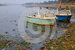 Police motorboats moored on Yamuna River near Taj Mahal in Agra, Uttar Pradesh, India