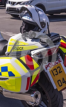 Police motorcycle with crash helmet and communications unit.