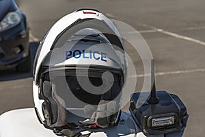 Police motorcyclist, crash helmet and communications unit.