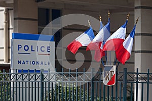 Police nationale sign and French flag