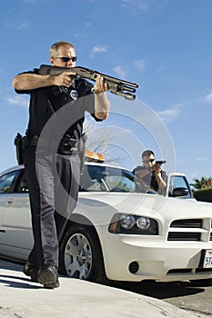 Police Officer Aiming Shotgun