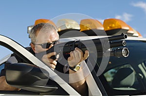 Police Officer Aiming Shotgun