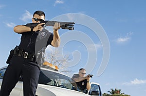Police Officer Aiming Shotgun