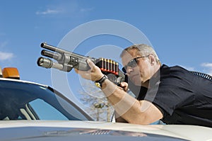 Police Officer Aiming Shotgun