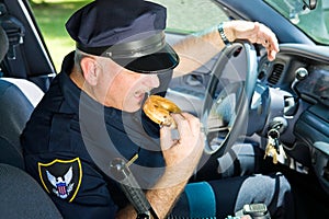 Police Officer Eating Donut