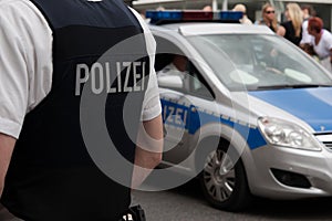 Police officer in front of a crowd