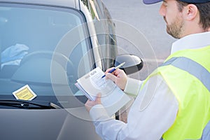 Police officer giving a fine for parking violation