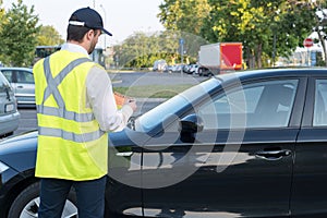 Police officer giving a fine for parking violation