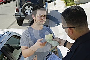 Police Officer Holding Out Ticket