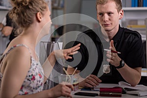 Police officer interrogating woman