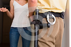 Police officer interrogation woman at front door