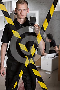 Police officer showing police badge