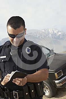 Police Officer Taking Notes