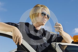 Police Officer Using Two-Way Radio photo