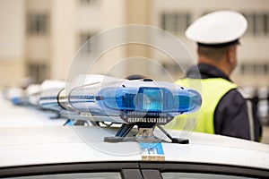 Police officers cars warning lightbars