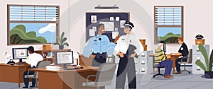 Police officers inside detective bureau. Policemen in uniform talking and working at computers in investigation